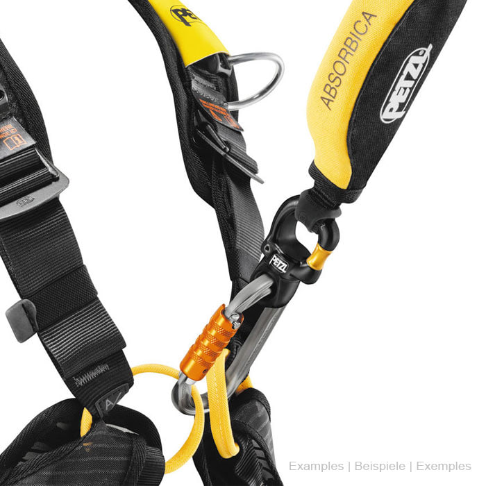 Micro Swivel by Petzl in black with gold swivel attached to a yellow and black harness, together with a grey carabiner and yellow rope