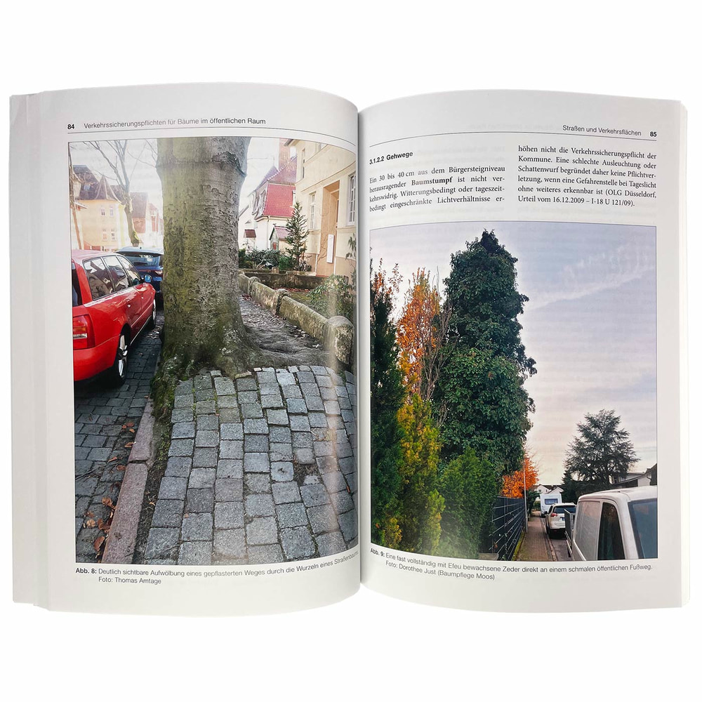 Open book Traffic safety obligation for trees with photographs of trees on sidewalks and text on pages 84 and 85